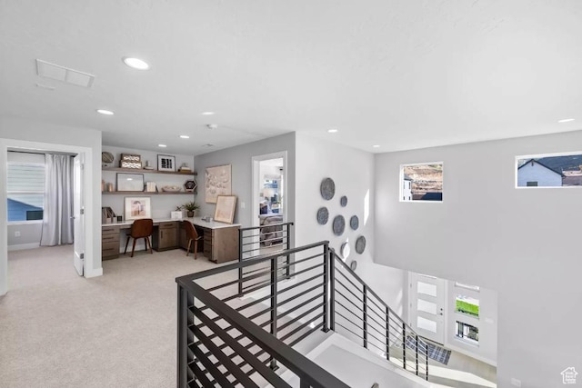 5877 N Canyon Rim Rd Unit 623, Lehi, UT 84043 - corridor featuring an upstairs landing, a desk, recessed lighting, and light colored carpet