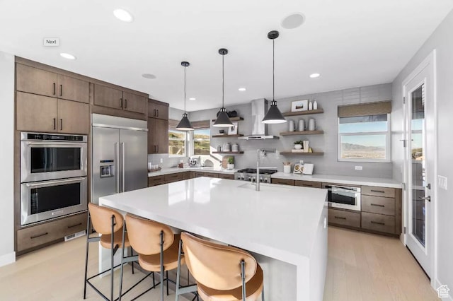 5877 N Canyon Rim Rd Unit 623, Lehi, UT 84043 - kitchen with stainless steel appliances, wall chimney range hood, open shelves, decorative backsplash, and light countertops