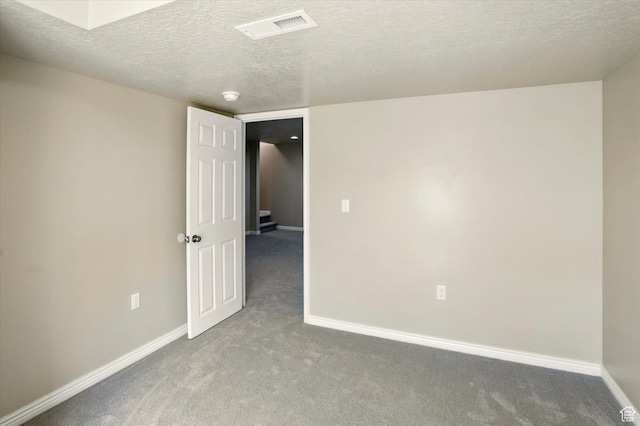 11569 S Oakmond Rd, South Jordan, UT 84009 - empty room featuring carpet floors, baseboards, and a textured ceiling