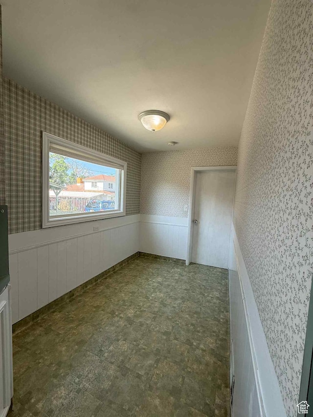 229 N Carbon Ave, Price, UT 84501 - spare room with a wainscoted wall and wallpapered walls