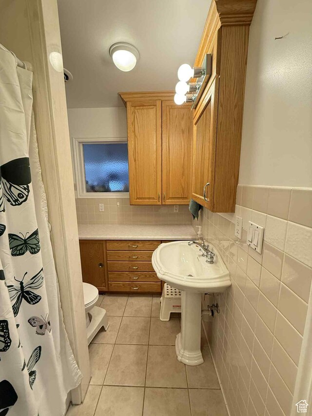 229 N Carbon Ave, Price, UT 84501 - bathroom with tile patterned flooring, toilet, and tasteful backsplash