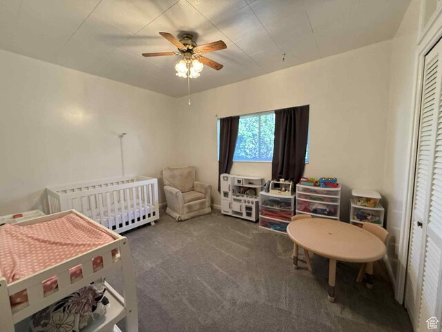 229 N Carbon Ave, Price, UT 84501 - carpeted bedroom with radiator, a ceiling fan, and a crib