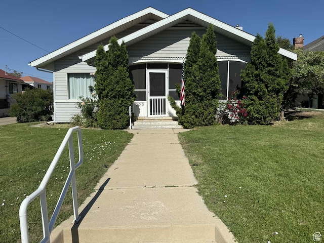 229 N Carbon Ave, Price, UT 84501 - bungalow-style house with a front lawn and entry steps