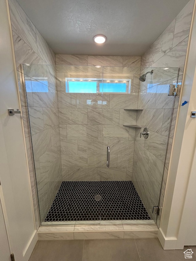 554 N 800 W, Smithfield, UT 84335 - bathroom with plenty of natural light, a stall shower, and tile patterned flooring