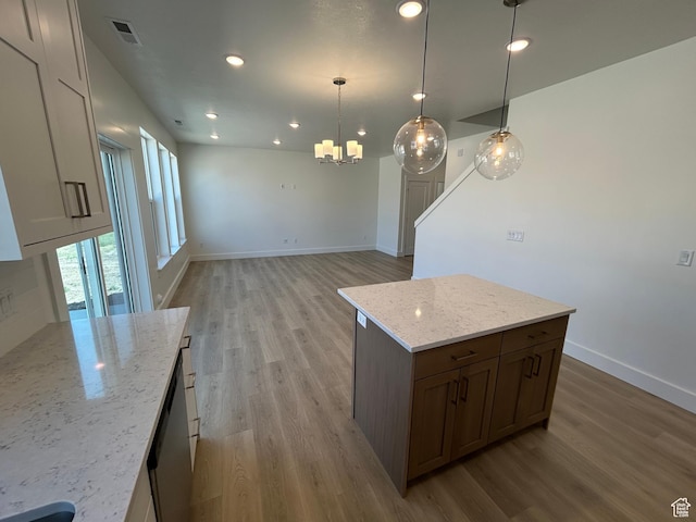 554 N 800 W, Smithfield, UT 84335 - kitchen with light wood finished floors, a chandelier, baseboards, light stone countertops, and recessed lighting