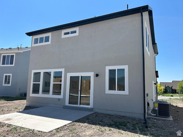 554 N 800 W, Smithfield, UT 84335 - back of property with a patio area, cooling unit, and stucco siding