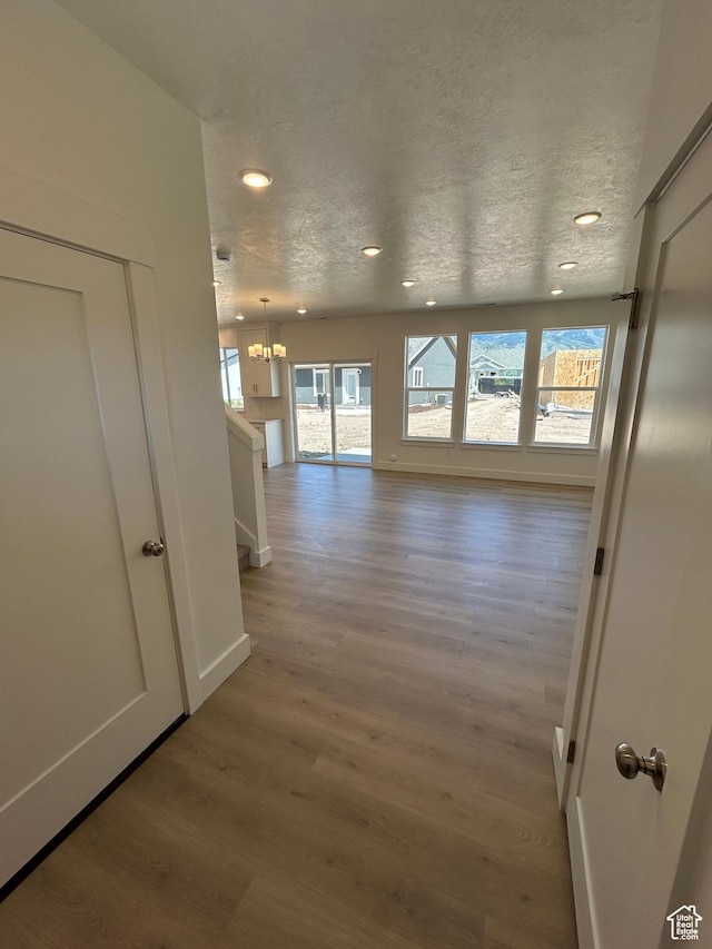 554 N 800 W, Smithfield, UT 84335 - hall featuring light wood-style flooring, recessed lighting, a chandelier, and baseboards