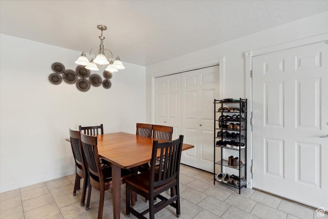 2631 W 5625 S, Roy, UT 84067 - dining room with a chandelier, light tile patterned flooring, and baseboards