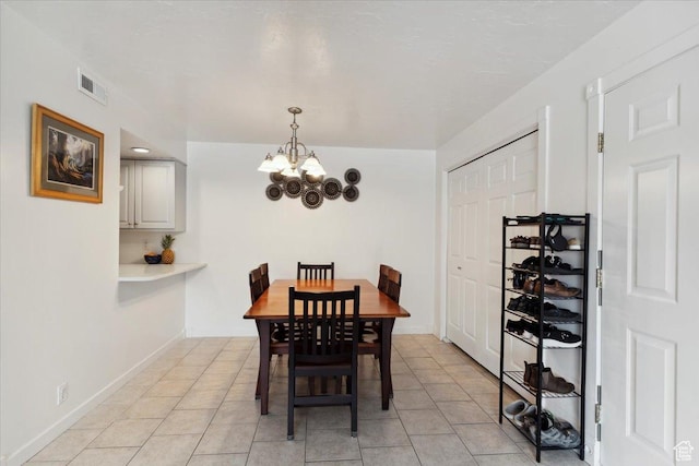 2631 W 5625 S, Roy, UT 84067 - dining room featuring a chandelier, light tile patterned floors, and baseboards