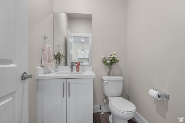 1871 S 1030 W, Orem, UT 84058 - bathroom with toilet, vanity, wood finished floors, and baseboards