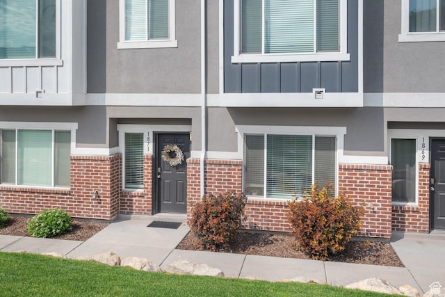 1871 S 1030 W, Orem, UT 84058 - property entrance featuring brick siding, board and batten siding, and stucco siding
