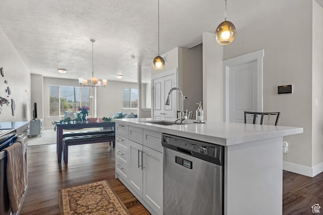 1871 S 1030 W, Orem, UT 84058 - kitchen featuring stainless steel dishwasher, a sink, dark wood-style floors, light countertops, and white cabinetry
