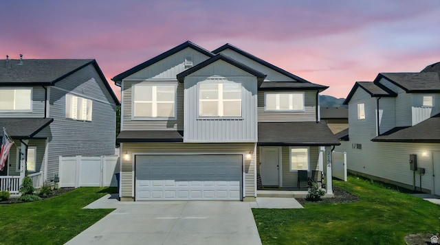 2124 S 1490 W, Wellsville, UT 84339 - view of front of property featuring board and batten siding, a garage, concrete driveway, and covered porch