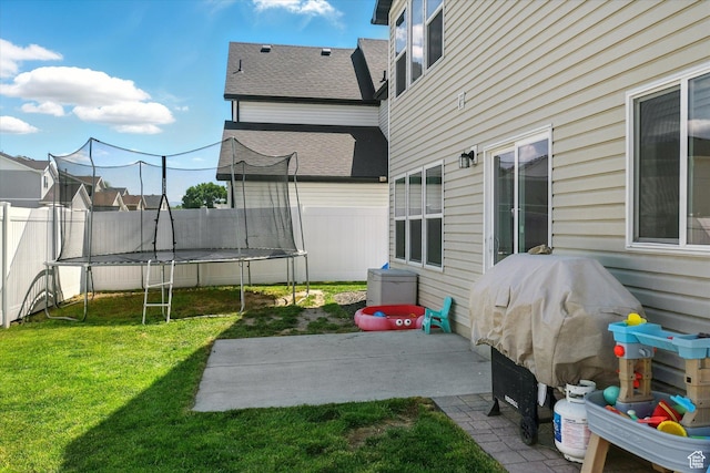 2124 S 1490 W, Wellsville, UT 84339 - view of yard featuring a trampoline and a patio area