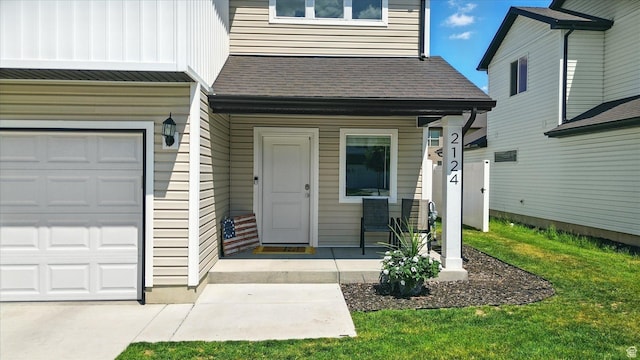 2124 S 1490 W, Wellsville, UT 84339 - entrance to property featuring roof with shingles, an attached garage, and a yard