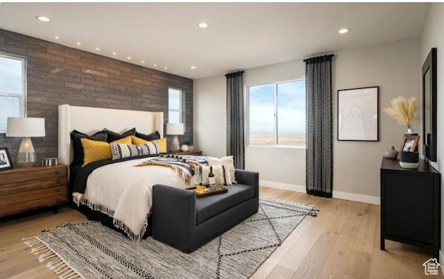 1298 W Sostice Dr Unit 335, Lehi, UT 84043 - bedroom featuring baseboards, recessed lighting, an accent wall, and light wood finished floors