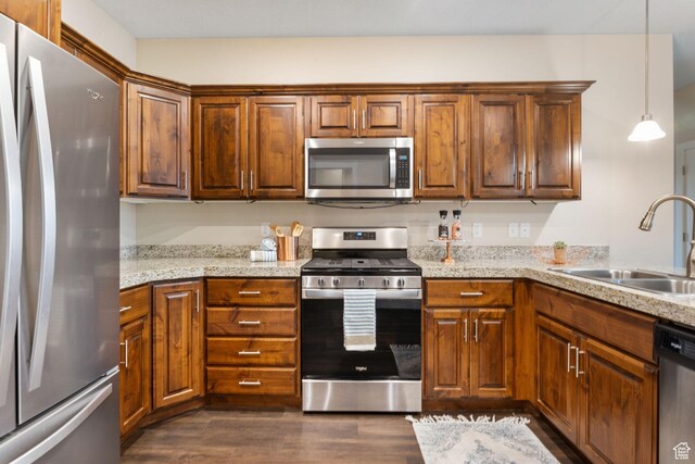 1736 W 300 S Unit D, Mapleton, UT 84664 - kitchen featuring stainless steel appliances, dark wood-style floors, a sink, pendant lighting, and light stone countertops