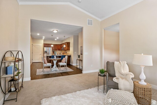 1736 W 300 S Unit D, Mapleton, UT 84664 - living area with dark colored carpet, baseboards, lofted ceiling, and crown molding