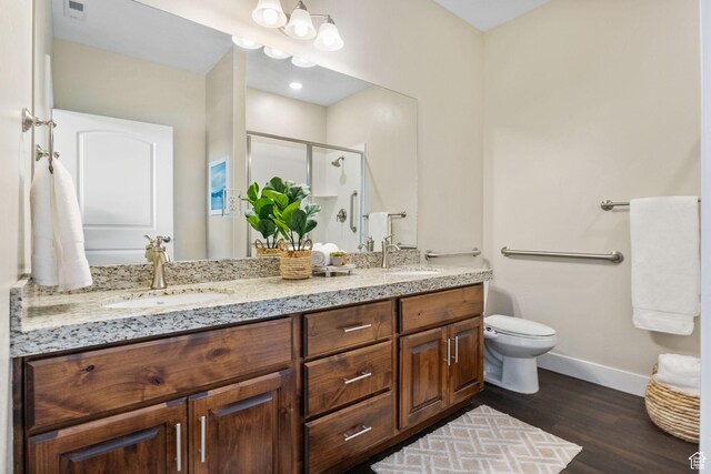 1736 W 300 S Unit D, Mapleton, UT 84664 - bathroom with baseboards, double vanity, wood finished floors, a stall shower, and toilet