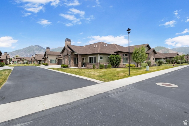 1736 W 300 S Unit D, Mapleton, UT 84664 - view of front facade featuring a mountain view, a residential view, and asphalt driveway