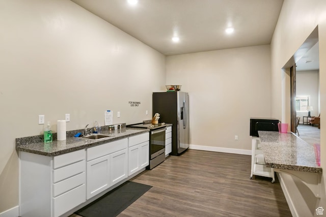 1736 W 300 S Unit D, Mapleton, UT 84664 - kitchen with stainless steel appliances, a sink, dark wood finished floors, white cabinetry, and recessed lighting