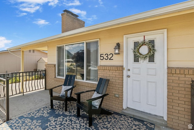 532 S 1500 E, Spanish Fork, UT 84660 - entrance to property featuring brick siding and a chimney