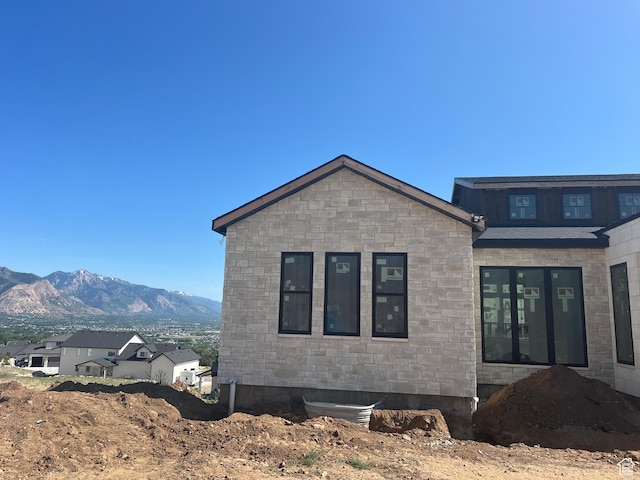 1293 W Caribou Ct, Pleasant View, UT 84414 - view of side of home featuring stone siding and a mountain view