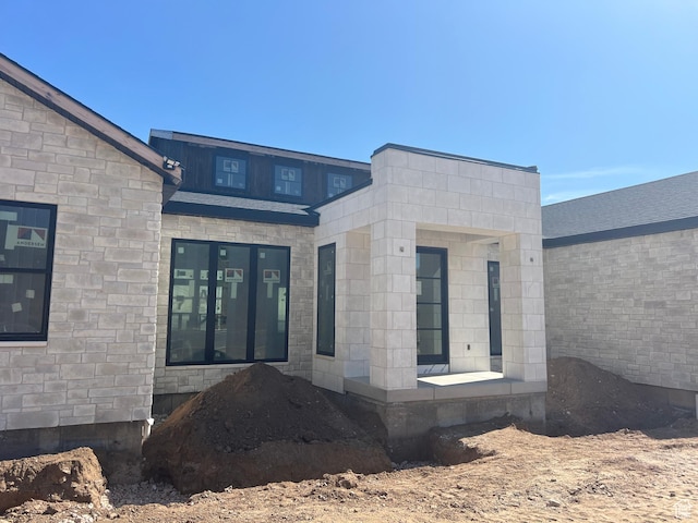 1293 W Caribou Ct, Pleasant View, UT 84414 - rear view of house with stone siding
