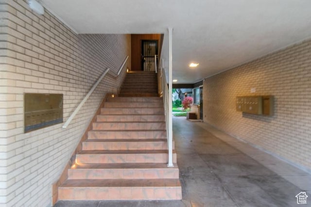 1132 E 2700 S Unit E36, Millcreek, UT 84106 - stairway featuring brick wall