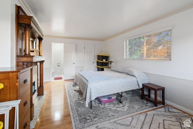 1132 E 2700 S Unit E36, Millcreek, UT 84106 - bedroom with light wood finished floors, ornamental molding, and ensuite bath