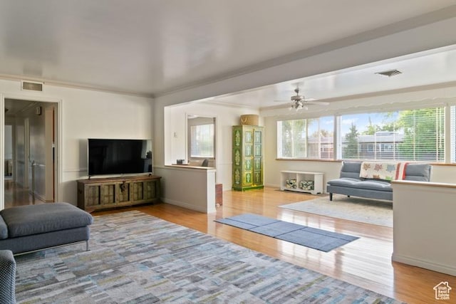 1132 E 2700 S Unit E36, Millcreek, UT 84106 - living room with plenty of natural light, wood finished floors, and a ceiling fan