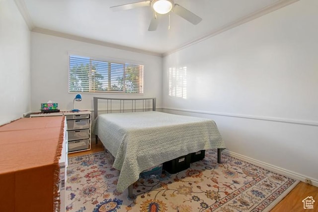 1132 E 2700 S Unit E36, Millcreek, UT 84106 - bedroom with ornamental molding, wood finished floors, and a ceiling fan