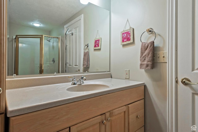 12144 S Mountain Shadow Rd, Sandy, UT 84092 - bathroom featuring vanity, a stall shower, and a textured ceiling