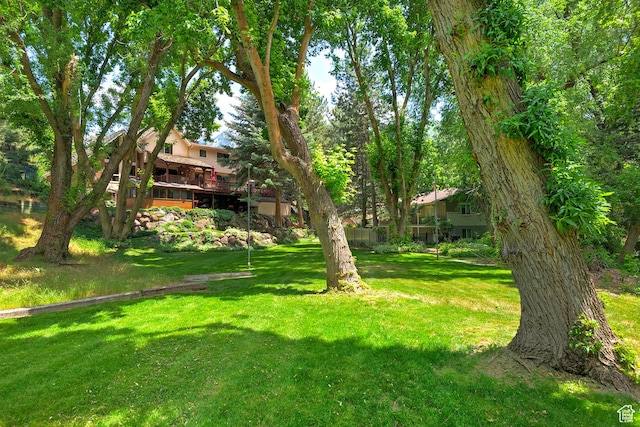 12144 S Mountain Shadow Rd, Sandy, UT 84092 - view of grassy yard with a deck