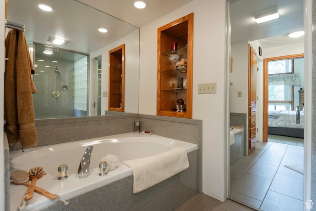 12144 S Mountain Shadow Rd, Sandy, UT 84092 - full bath with ensuite bath, a garden tub, a shower stall, tile patterned floors, and recessed lighting