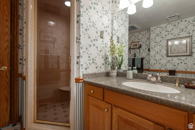 12144 S Mountain Shadow Rd, Sandy, UT 84092 - full bathroom featuring wallpapered walls, a stall shower, and vanity