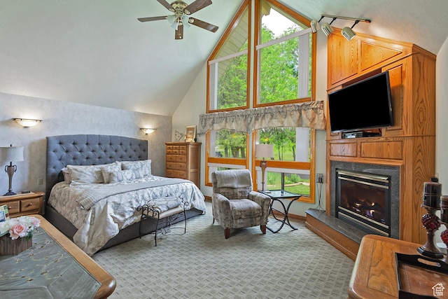 12144 S Mountain Shadow Rd, Sandy, UT 84092 - bedroom with a glass covered fireplace, high vaulted ceiling, and light colored carpet