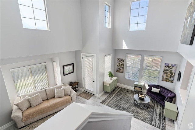 160 S 2875 W, West Point, UT 84015 - living room with a towering ceiling, baseboards, and wood finished floors