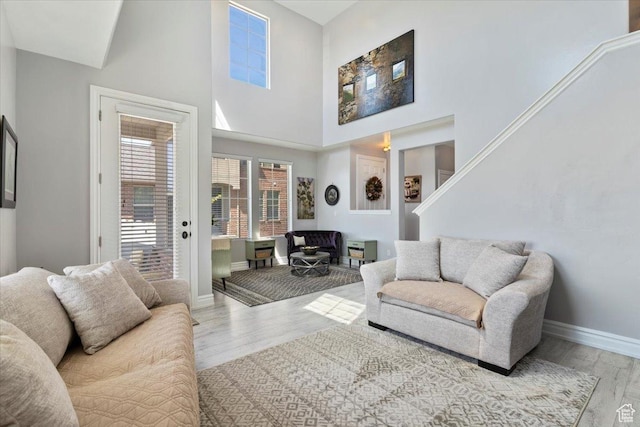 160 S 2875 W, West Point, UT 84015 - living room featuring baseboards, wood finished floors, and a high ceiling