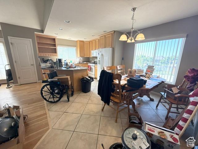 5653 N Poppy Cir, Stansbury Park, UT 84074 - dining space with a chandelier and recessed lighting