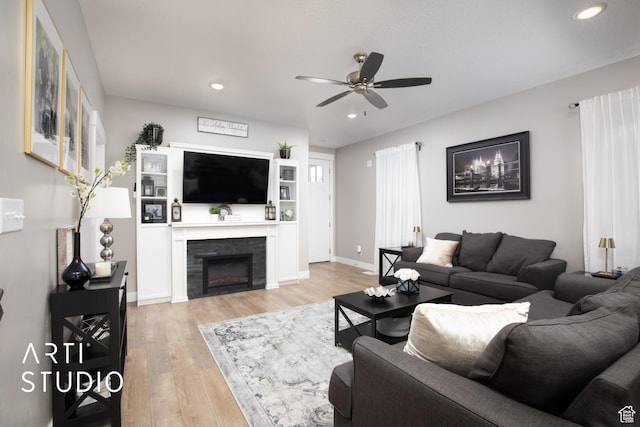 3516 N Willy Way, Eagle Mountain, UT 84005 - living room with a ceiling fan, light wood-style floors, recessed lighting, a fireplace, and baseboards