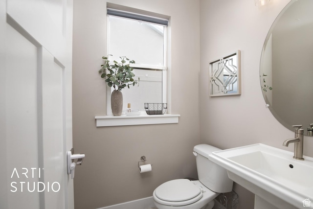 3516 N Willy Way, Eagle Mountain, UT 84005 - bathroom with toilet, a sink, and baseboards