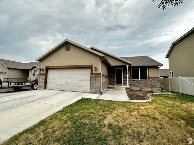 1879 E 1130 S, Spanish Fork, UT 84660 - view of front facade with a garage, driveway, brick siding, and stucco siding