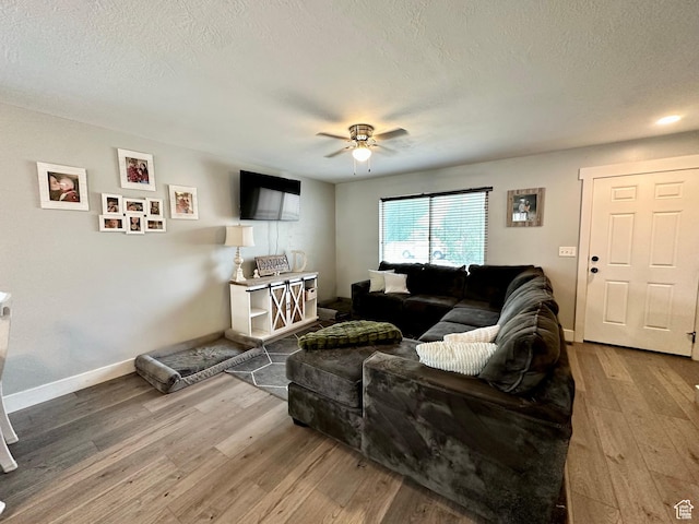 1879 E 1130 S, Spanish Fork, UT 84660 - living area featuring wood finished floors, a ceiling fan, a textured ceiling, and baseboards
