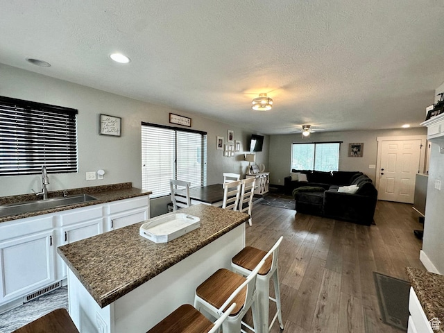 1879 E 1130 S, Spanish Fork, UT 84660 - kitchen with a sink, white cabinets, a textured ceiling, a ceiling fan, and dark wood-style floors