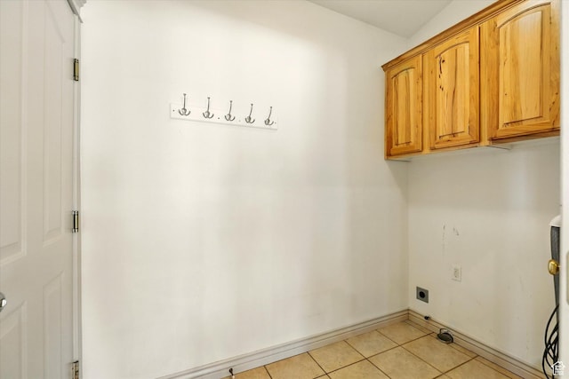 192 S 100 E, Wellsville, UT 84339 - washroom featuring hookup for an electric dryer, cabinet space, and light tile patterned flooring