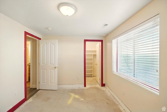 192 S 100 E, Wellsville, UT 84339 - unfurnished bedroom featuring a walk in closet and a closet