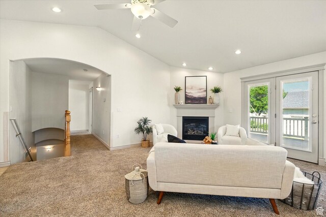 192 S 100 E, Wellsville, UT 84339 - carpeted living area featuring arched walkways, lofted ceiling, a glass covered fireplace, recessed lighting, and ceiling fan