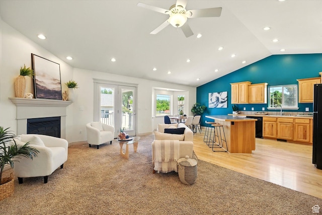 192 S 100 E, Wellsville, UT 84339 - living room featuring vaulted ceiling, recessed lighting, a glass covered fireplace, light wood-style floors, and a ceiling fan