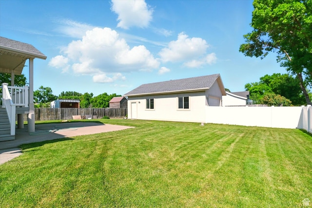 192 S 100 E, Wellsville, UT 84339 - fenced backyard featuring a patio area